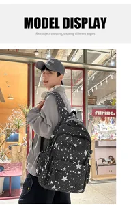 Stylish black star print casual backpack for men and women, perfect for daily commuting.