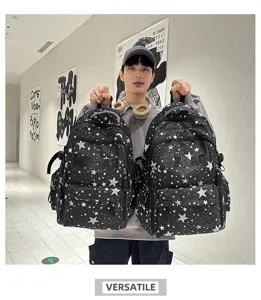 Detailed view of the stylish black star-printed backpack with multiple pockets and trendy design.
