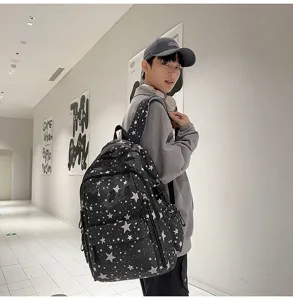 Stylish black backpack with white star print, casual campus school bag for daily commuting and travel.