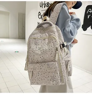 Grey star printed canvas school backpack with multiple compartments for students and daily use.