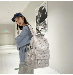 Casual star print school backpack for students, stylish multi-pocket travel daypack for teens.