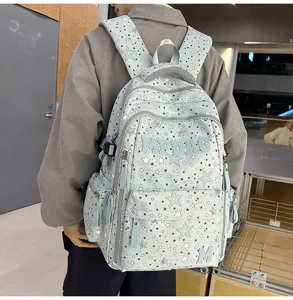 Detail shot of the stylish star pattern casual backpack showing texture and embroidery.