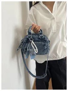 Close-up detail of the retro Korean style mini denim crossbody bag featuring cute pearl star charms.