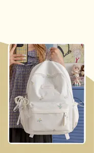 Sweet white backpack with colorful bow embroidery for women, perfect for school and travel.