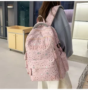 Pink star pattern casual school backpack with spacious compartments and adjustable straps for daily use.