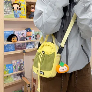 Yellow green grid bucket bag canvas small crossbody bag for women casual outdoor travel.
