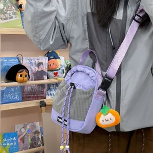 Purple grey plaid bucket bag with drawstring closure and cute orange pendant for daily use.