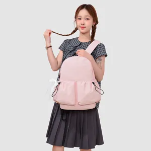 Bonita mochila rosa con bolsillos de cordón y lazo, mochila escolar ligera para niñas.