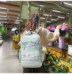 Zaino scolastico verde menta carino con fiocchi e volant per ragazze eleganti e uso quotidiano.