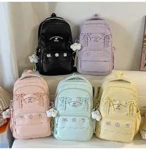 Zaino carino con fiocco, colori pastello, borsa scolastica elegante per ragazze ogni giorno.