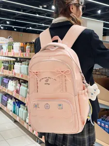 Zaino rosa carino con fiocco per scuola e viaggi, leggero e di design alla moda.