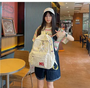 Sac à dos crème avec étoiles et lettres, cartable étudiant mignon pour les voyages et le quotidien.