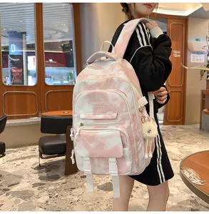 Zaino rosa tie dye per ragazze, grande borsa scolastica per studenti con ciondolo peluche