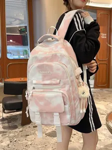 Zaino scolastico rosa tie dye con tasche multiple e ciondolo in peluche per ragazze.