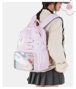 Schattige roze geruite ita rugzak met strikken en doorzichtig vak voor studenten stijl chic.