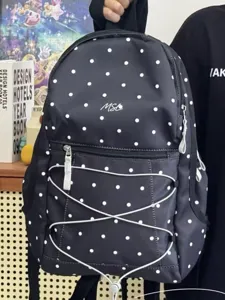 Korean style black white polka dot backpack with front zipper pocket and bungee cord.