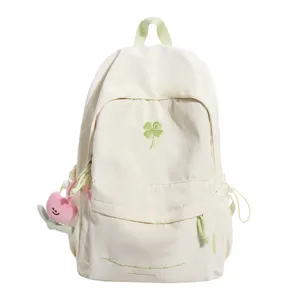 Green clover embroidered canvas backpack, sweet casual school bag with cute plush pendant for girls.