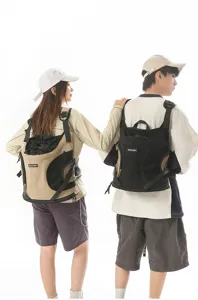 Outdoor portable pet carrier backpack with breathable mesh design, comfortable travel bag for cats.