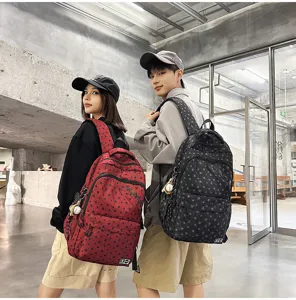 Trendy star print street style couple backpack with multiple compartments for students daily use.