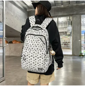 Retro street style star print canvas backpack with multiple compartments for student daily use.