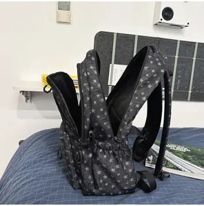 Detailed view of retro star print canvas backpack with multiple compartments and pockets.