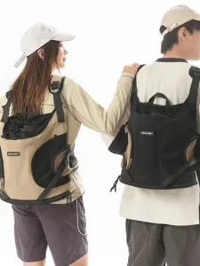 Outdoor portable pet backpack with breathable mesh design, comfortable travel bag for dogs and cats.