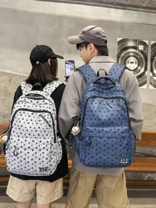 Trendy couple backpack with star print, durable multi-compartment school bag for students.