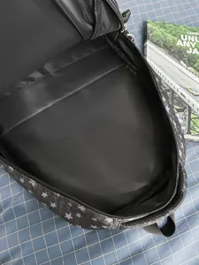 Black star pattern casual backpack, multi-compartment student school bag for daily use.