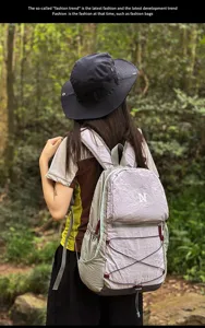 Outdoor hiking backpack detail view showcasing lightweight color-block design and drawstring.