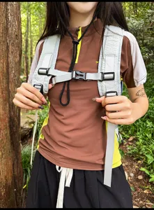 Outdoor backpack chest strap detail, lightweight gorpcore daypack with durable adjustable buckles.