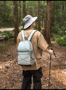 Lightweight outdoor hiking backpack with contrast bungee cords for travel and camping.