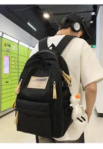 Black tactical backpack with multi compartments, casual school bookbag for students and travel use.