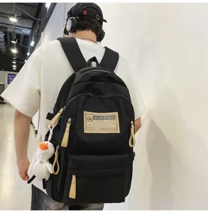 Cool black utility backpack with khaki accents, multi-compartment student school bag detail.