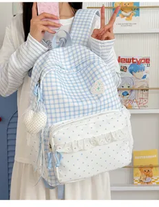Korean style sweet milk blue plaid backpack with cute lace ruffle and heart pendant for school.
