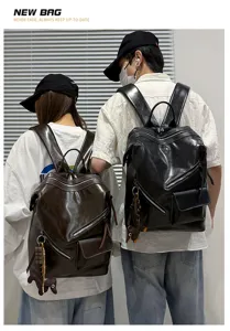 Detailed view of vintage leather couple backpacks showcasing design, texture, and metal zipper details.