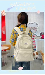 Sac à dos kawaii à pois pour filles, cartable scolaire élégant et décontracté.