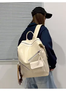 Retro PU leather backpack for women, casual commuter bookbag with zip pockets.