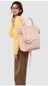 Pink multi-functional diaper backpack, large capacity travel mom bag with stylish casual design.