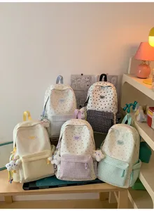 Cute star plaid school backpack with matching cute pendant, perfect for daily student use.
