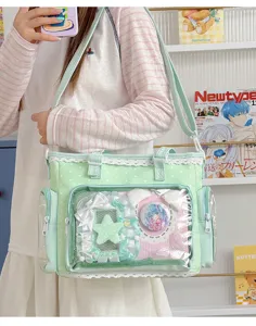 Deliziosa borsa ita a pois verde pastello con pizzo e finestra trasparente per spille.