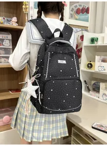 Black star print school backpack with cute lace trim for daily student travel and casual use.