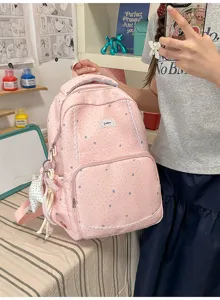 Pink star pattern school backpack detail view featuring cute lace trim and side pocket.