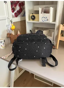 Black and white star pattern backpack, casual daily school travel bag for students.