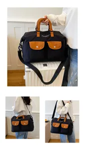 Large capacity contrast color travel duffel bag with shoulder strap and multiple pockets.