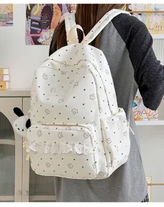 Close-up of sweet Lolita star pattern backpack detail featuring delicate lace ruffle pocket.
