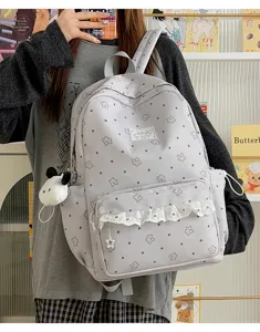 Japanese Lolita style grey backpack with cute star dot pattern and white lace ruffle trim.