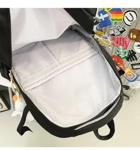 Detailed interior view of the black backpack highlighting spacious multi-compartment storage.