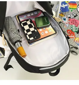 Detail view of black backpack interior capacity showing multi-compartment storage space.
