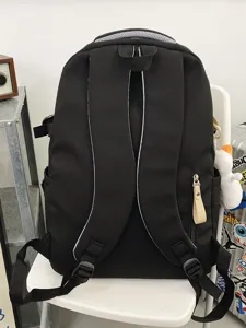 Durable black utility backpack for students, multi-compartment casual daypack for travel school