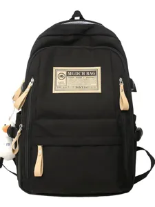 Classic black canvas backpack with khaki leather patch, multi-compartment casual school bag.